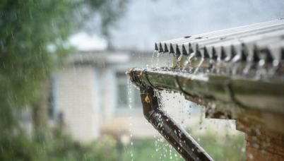 Rain striking a gutter 