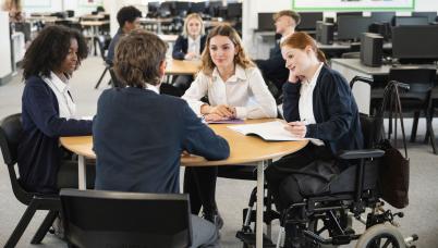 Students sitting around a work table