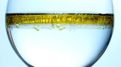olive oil floating on water demonstrating density